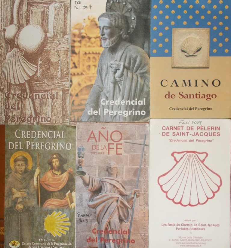 Photo of six different Credenciales, or pilgrim passports, from the Camino de Santiago in Spain and France