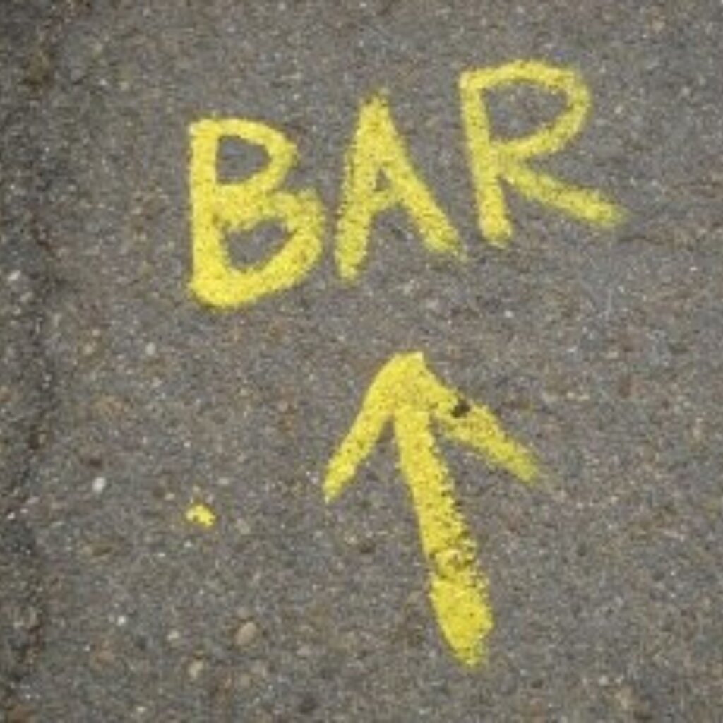 photo of the word bar painted on the ground