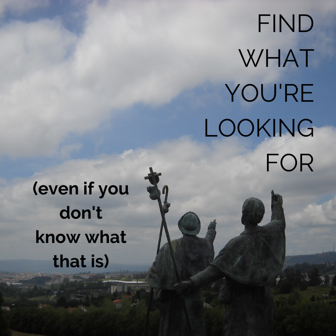 Photo of the two pilgrim statues at Monte de Goza near Santiago de Compostela, with the words "find what you're looking for, even if you don't know what that is"