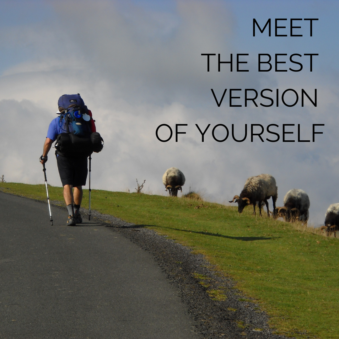 photo of a man hiking in the Pyrenees on the Napoleon route of the Camino Frances, with the words "meet the best version of yourself"