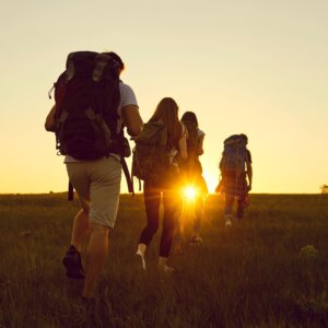 Photo of hikers carrying backpacks