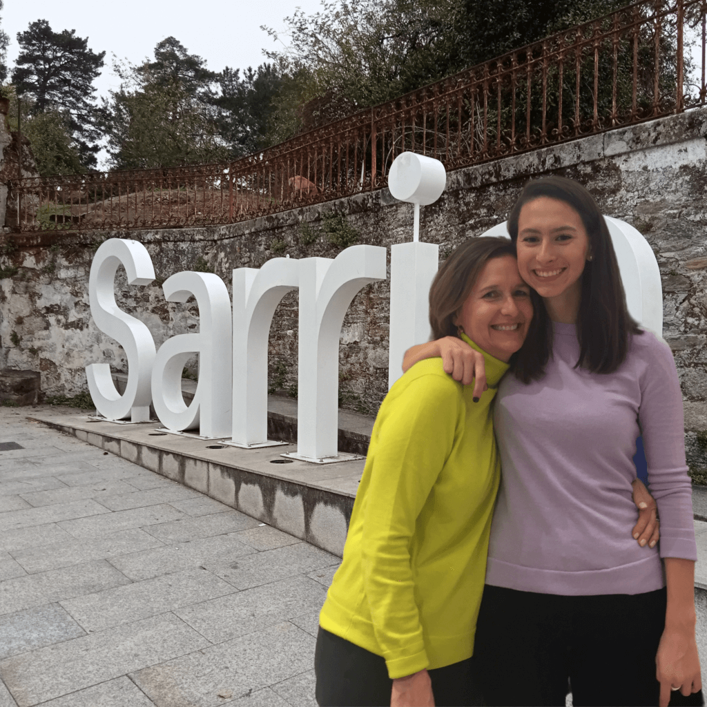 photo of two women and Sarria sign