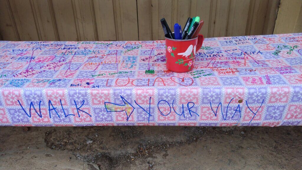 bench with cup of markers